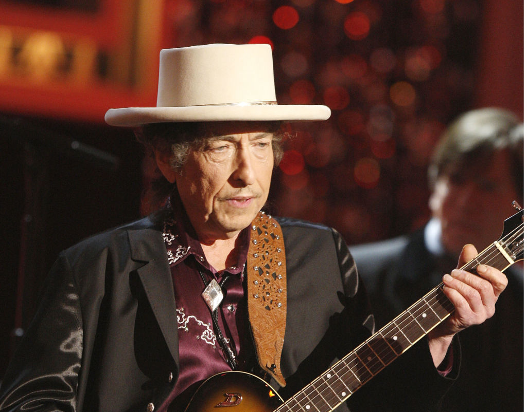 Bob Dylan did not perform his hit songs on tour, causing mixed reactions from the audience