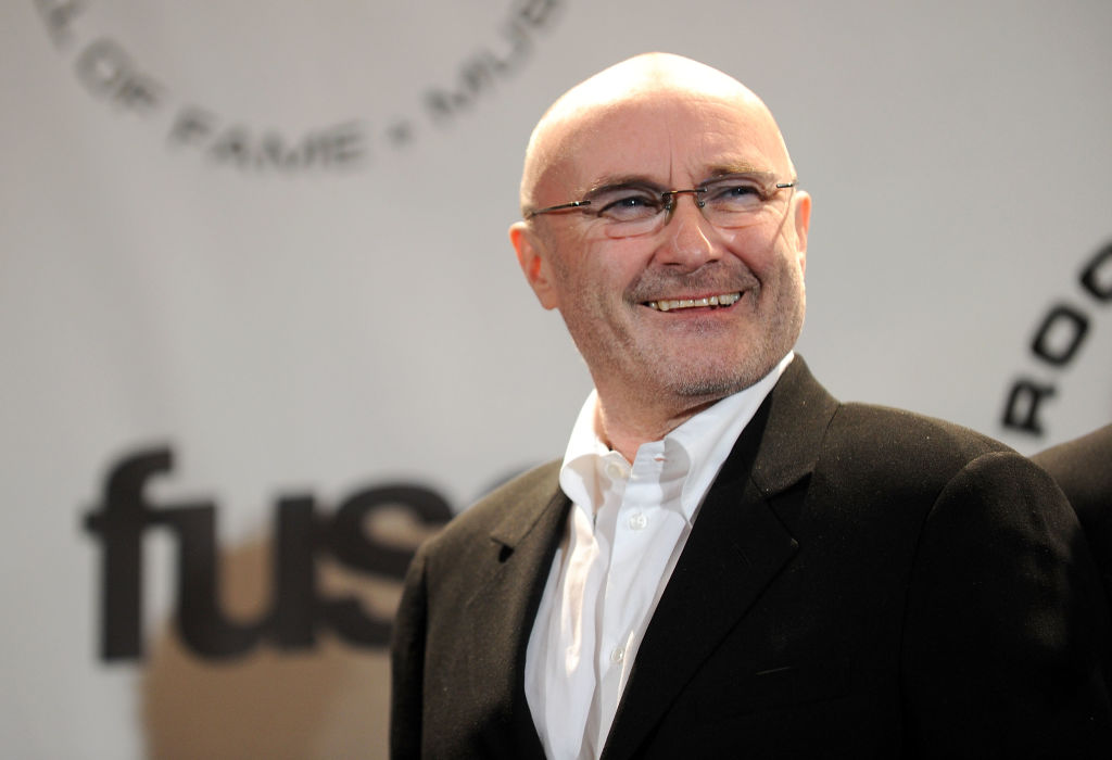 Phil Collins No Longer Able To Hold Drumsticks Due To Shocking Health Diagnosis, Genesis Band Member Drops Out of Tour?
