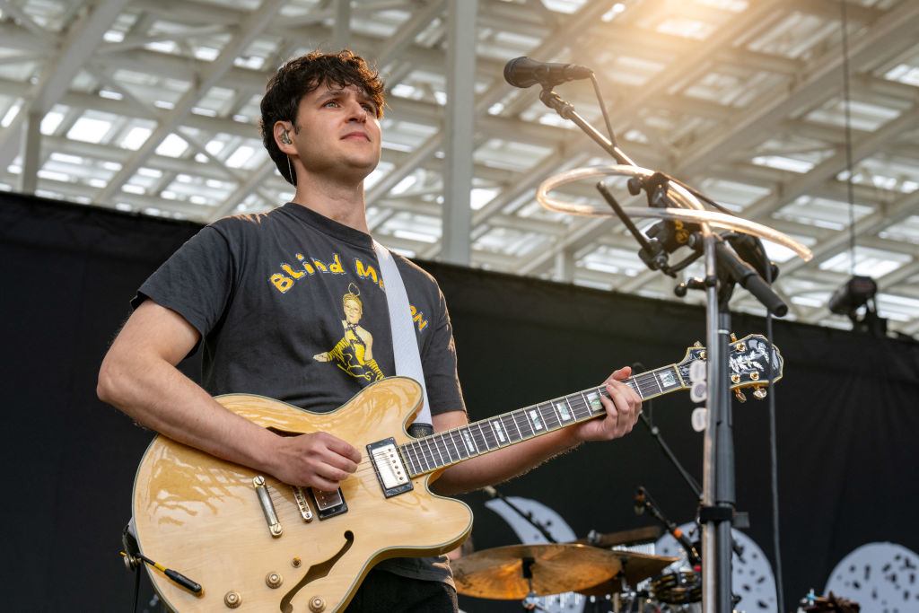 Vampire Weekend singer Ezra Koenig performs during a concert at the Moody Amphitheater while a total solar eclipse progresses across North America, in Austin, Texas, on April 8, 2024.