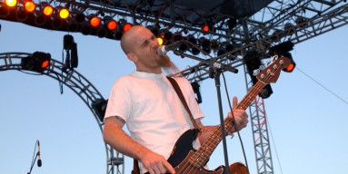 Nick Oliveri performing with the band in 2002