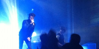 AFI frontman Davey Havok sings to Webster Hall in a very grainy photo taken from the pit. 