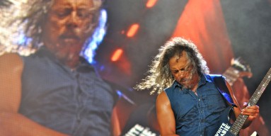 Giant Kirk Hammett plays a harmonic for little Kirk Hammett. 