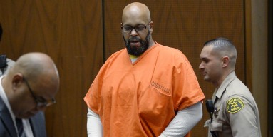 Marion 'Suge' Knight (C), who is charged with murder, attempted murder and hit-and-run for allegedly running down two men in Compton killing one of them, appears in court for his arraignment at Criminal Courts Building 