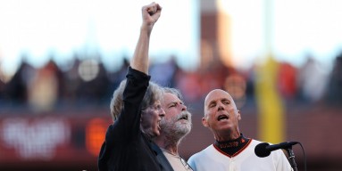 Founding members of The Greatful Dead Phil Lesh, Bob Weir and San Francisco Giants third base coach Tim Flannery sing the national anthem prior to Game Two of the National League Championship Series against the St. Louis Cardinals at AT&T Park