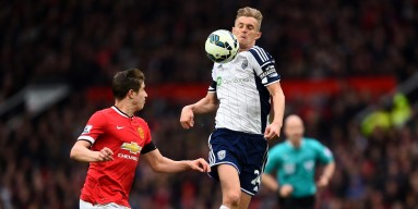 Darren Fletcher of West Brom controls the ball under pressure from Paddy McNair of Manchester United during the Barclays Premier League match between Manchester United and West Bromwich Albion at Old Trafford on May 2, 2015 in Manchester, England. (