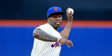 Rap artist 50 Cent throws the ceremonial first pitch of a game between the New York Mets and the Pittsburgh Pirates at Citi Field on May 27, 2014 in the Flushing neighborhood of the Queens borough of New York City. 