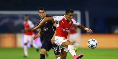 Alexis Sanchez of Arsenal controls the ball as he is closed down by Leonardo Sigali of Dinamo Zagreb during the UEFA Champions League Group F match between Dinamo Zagreb and Arsenal at Maksimir Stadium on September 16, 2015 in Zagreb, Croatia. 