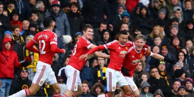 Bastian Schweinsteiger of Manchester United celebrates his team's second goal scored by Troy Deeney of Watford with his team mates during the Barclays Premier League match between Watford and Manchester United at Vicarage Road on November 21, 2015 in Watf