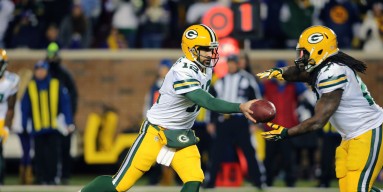 Aaron Rodgers #12 hands off the ball to Eddie Lacy #27 of the Green Bay Packers in the fourth quarter on November 22, 2015 at TCF Bank Stadium in Minneapolis, Minnesota. The Packers defeated the Vikings 30-13.
