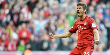 Thomas Mueller of Muenchen celebrates after scoring the opening/first goal during the Bundesliga match between FC Bayern Muenchen and Borussia Dortmund at Allianz Arena on October 4, 2015 in Munich, Germany. 