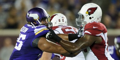 Scott Crichton #95 of the Minnesota Vikings sets a block against the Arizona Cardinals during the game on August 16, 2014 at TCF Bank Stadium in Minneapolis, Minnesota. The Vikings defeated the Cardinals 30-28. 