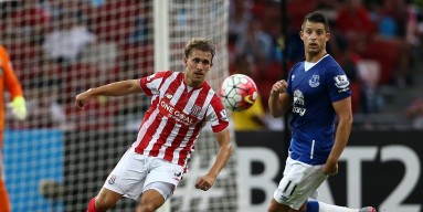 Marc Muniesa of Stoke City is checked by Kevin Mirallas of Everton during the Barclays Asia Trophy match between Everton and Stoke City at National Stadium on July 15, 2015 in Singapore. 
