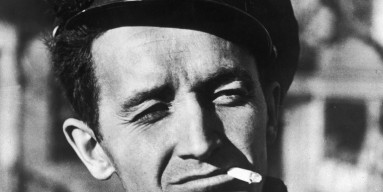 Woody Guthrie smoking & squinting