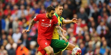 Danny Ings of Liverpool battles with Steven Whittaker of Norwich City during the Barclays Premier League match between Liverpool and Norwich City at Anfield on September 20, 2015 in Liverpool, United Kingdom. 