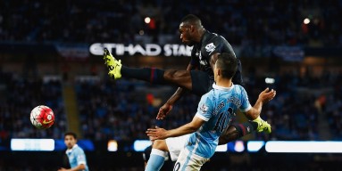 Michail Antonio of West Ham United controls the ball under pressure from Sergio Aguero of Manchester City during the Barclays Premier League match between Manchester City and West Ham United at Etihad Stadium on September 19, 2015 in Manchester, United Ki