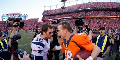 Tom Brady #12 of the New England Patriots congratulates Peyton Manning #18 of the Denver Broncos after the Broncos defeated the Patriots 26 to 16 during the AFC Championship game at Sports Authority Field at Mile High on January 19, 2014 in Denver, Colora