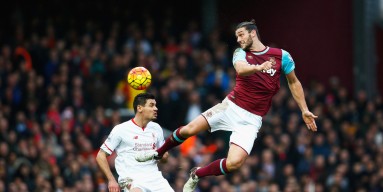 Andy Carroll of West Ham United and Dejan Lovren of Liverpool compete for the ball during the Barclays Premier League match between West Ham United and Liverpool at Boleyn Ground on January 2, 2016 in London, England. 