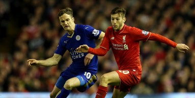 Adam Lallana of Liverpool (r) holds off Andy King of Leicester City during the Barclays Premier League match between Liverpool and Leicester City at Anfield on December 26, 2015 in Liverpool, England. 