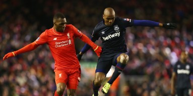  Angelo Ogbonna Obinza of West Ham United battles with Christian Benteke (L) and Joao Carlos Teixeira of Liverpool (R) during the Emirates FA Cup Fourth Round match between Liverpool and West Ham United at Anfield on January 30, 2016 in Liverpool, England