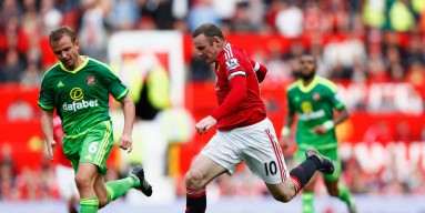 Wayne Rooney of Manchester United and Lee Cattermole of Sunderland compete for the ball during the Barclays Premier League match between Manchester United and Sunderland at Old Trafford on September 26, 2015 in Manchester, United Kingdom. 