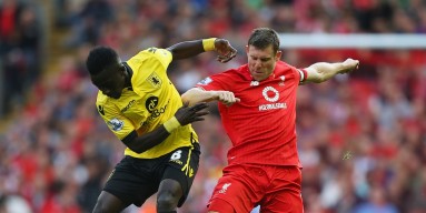  Idrissa Gueye of Aston Villa and James Milner of Liverpool compete for the ball during the Barclays Premier League match between Liverpool and Aston Villa at Anfield on September 26, 2015 in Liverpool, United Kingdom. 