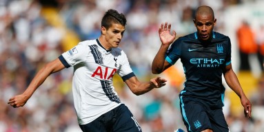 Erik Lamela of Tottenham Hotspur and Fernando of Manchester City compete for the ball during the Barclays Premier League match between Tottenham Hotspur and Manchester City at White Hart Lane on September 26, 2015 in London, United Kingdom. 