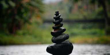 Black Stackable Stone Decor at the Body of Water