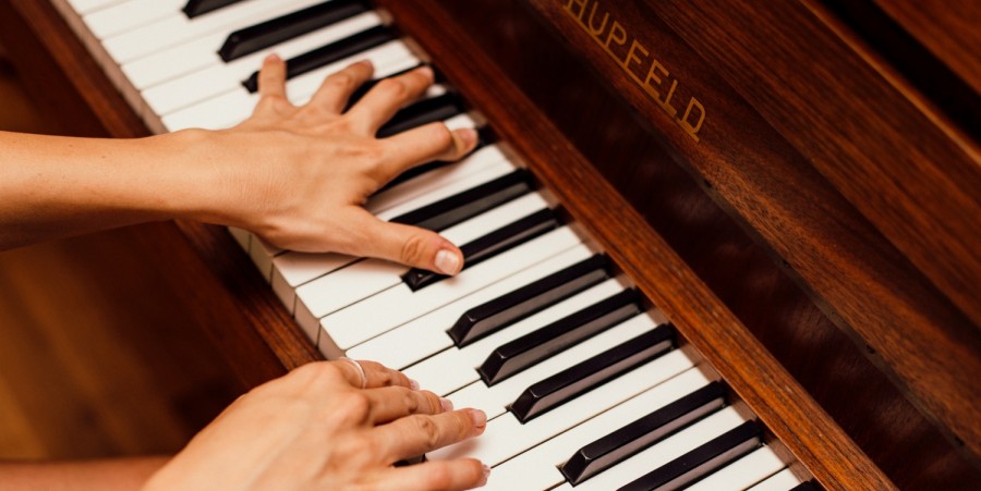 Close-Up Photo Of Person Playing Piano