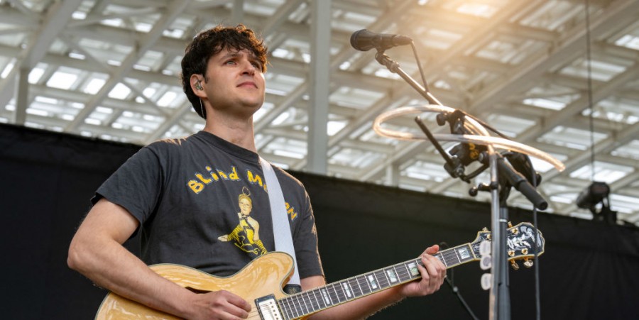 Vampire Weekend singer Ezra Koenig performs during a concert at the Moody Amphitheater while a total solar eclipse progresses across North America, in Austin, Texas, on April 8, 2024.