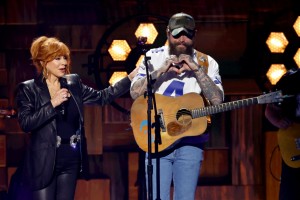 Host Reba McEntire and Post Malone speak onstage during the 59th Academy of Country Music Awards at The Ford Center at The Star on May 16, 2024 in Frisco, Texas. 