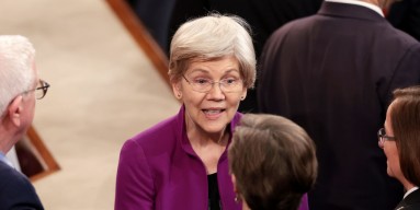 U.S. Sen. Elizabeth Warren (D-MA) talks to fellow members of Congress prior to the start of President Joe Biden's State of the Union address during a joint meeting of Congress in the House chamber at the U.S. Capitol on March 07, 2024 in Washington, DC. 